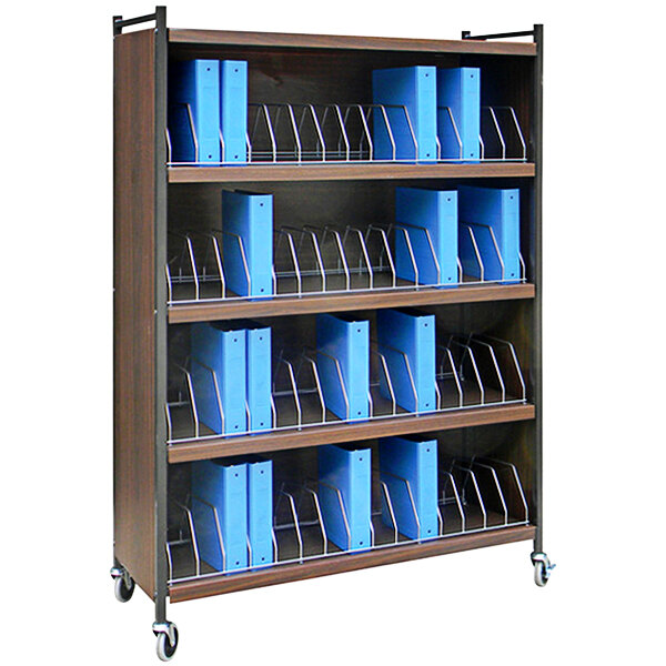 An Omnimed woodgrain medical cart with blue folders on shelves.