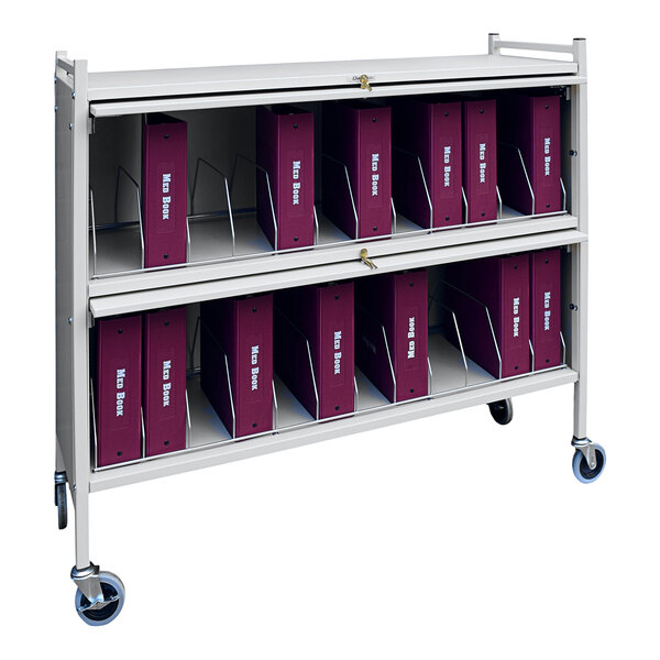 An Omnimed light grey cart with binders on it.