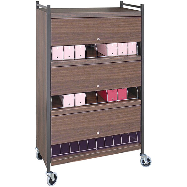 An Omnimed woodgrain cart with locking panels and 24 big beam closed drawers.