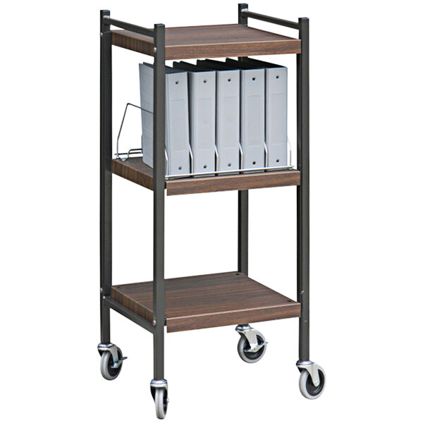 An Omnimed woodgrain open cart with binders on it.