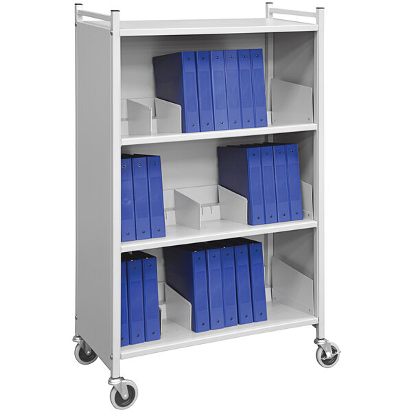 A light gray Omnimed cabinet rack with blue folders on the shelves.