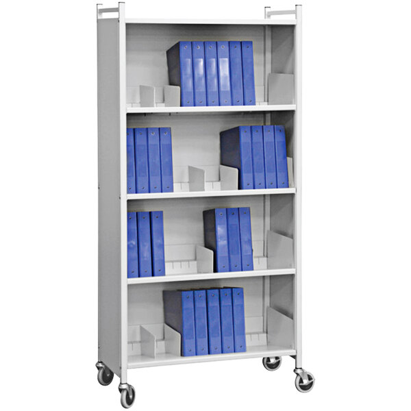A white Omnimed cabinet rack shelf with blue folders on it.