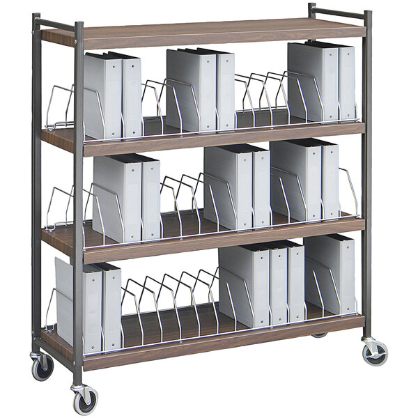 An Omnimed woodgrain open cart with white binders on the shelves.