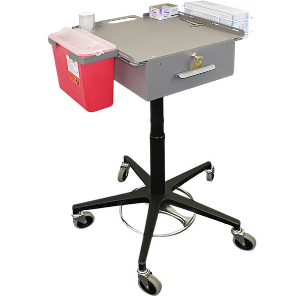 An Omnimed grey medical cart with a red container and tray.