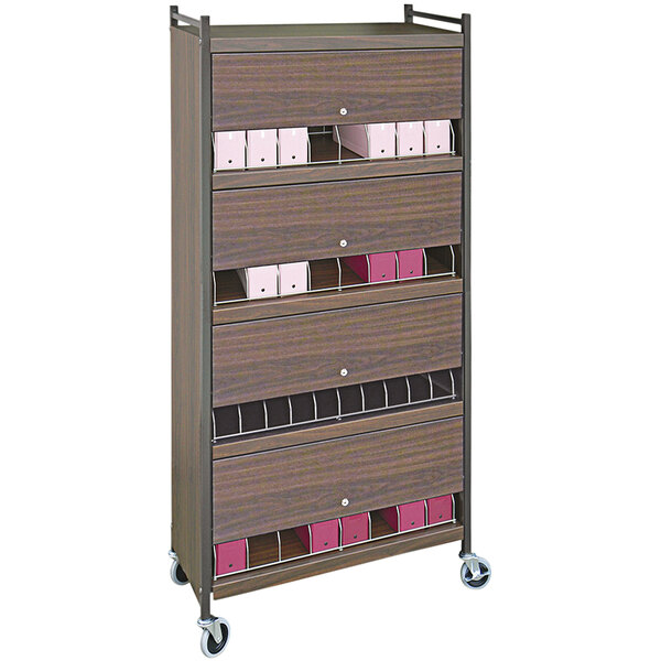 An Omnimed woodgrain cart with closed drawers.