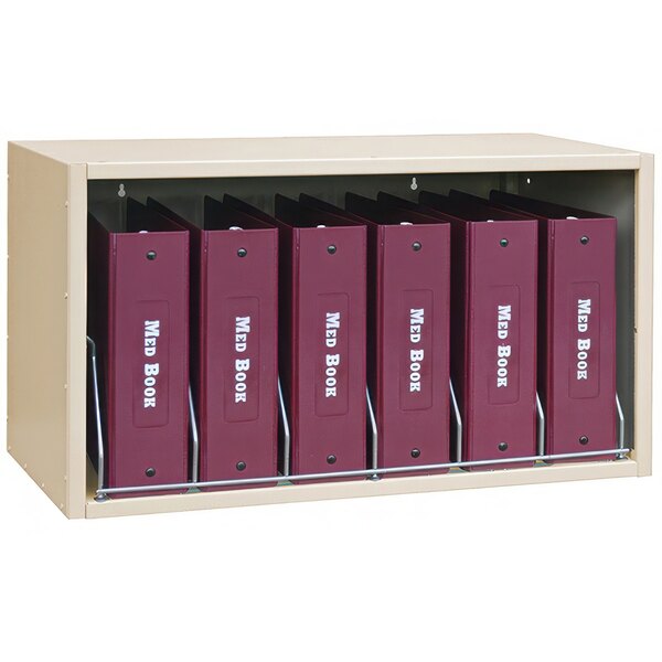 A beige Omnimed storage rack with six cubbies holding binder folders.