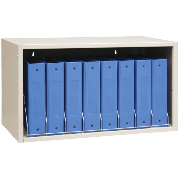 A beige rectangular storage rack with eight cubbies holding blue binders.