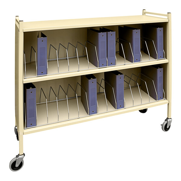 An Omnimed beige metal cart with binders on it.