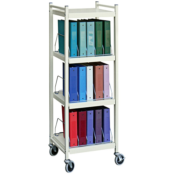An Omnimed beige metal cart with several binders on shelves.