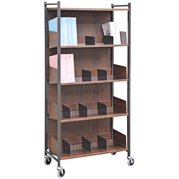 An Omnimed woodgrain cabinet rack with shelves holding books.