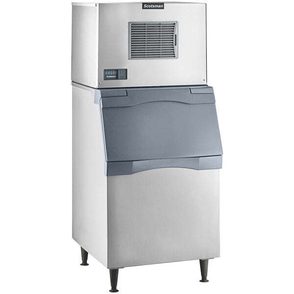 A Scotsman air cooled medium cube ice machine with a plastic storage bin.