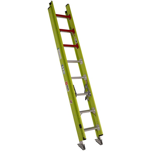 A yellow ladder with red handles.