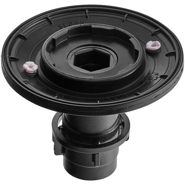 A black object in a box with a hexagon on the wheel