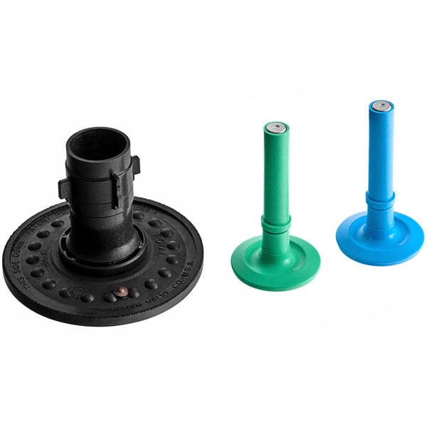 A black plastic and metal object and a blue plastic object on a table.