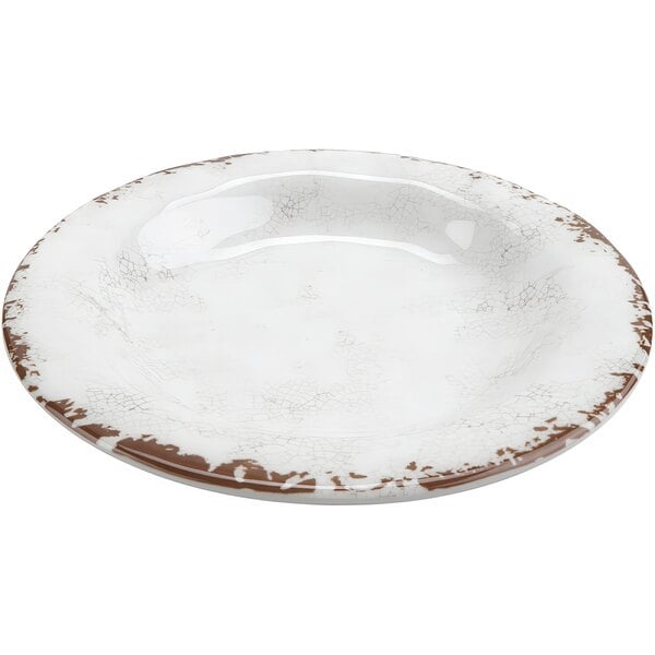 A white melamine bowl with a brown rim.