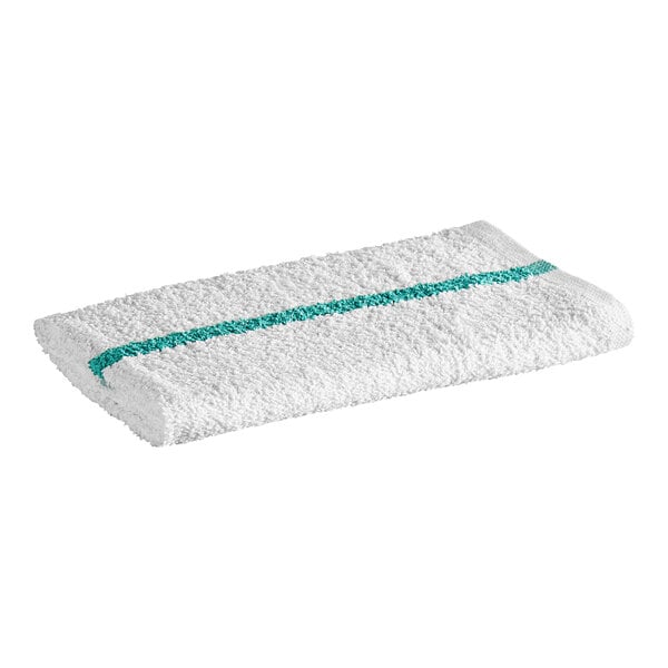 A white textured towel with a single green stripe running lengthwise across it.
