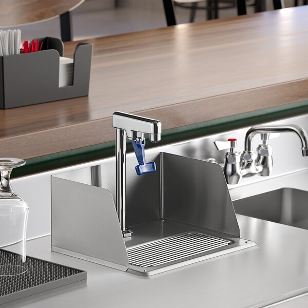 A Waterloo glass filler station with a splash guard and glass filler over a sink.