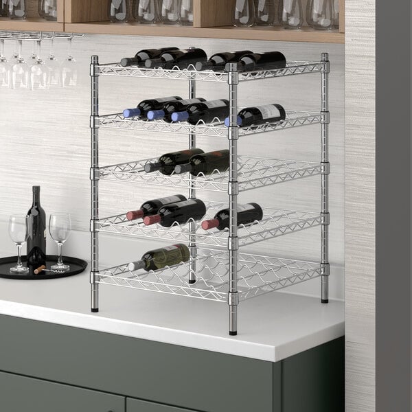 A Regency chrome wire wine rack with bottles on it.