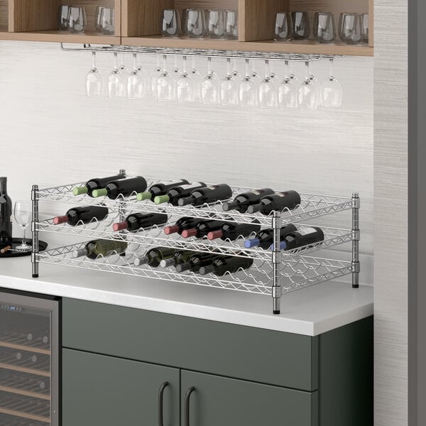 A Regency chrome wire wine rack with bottles on it.