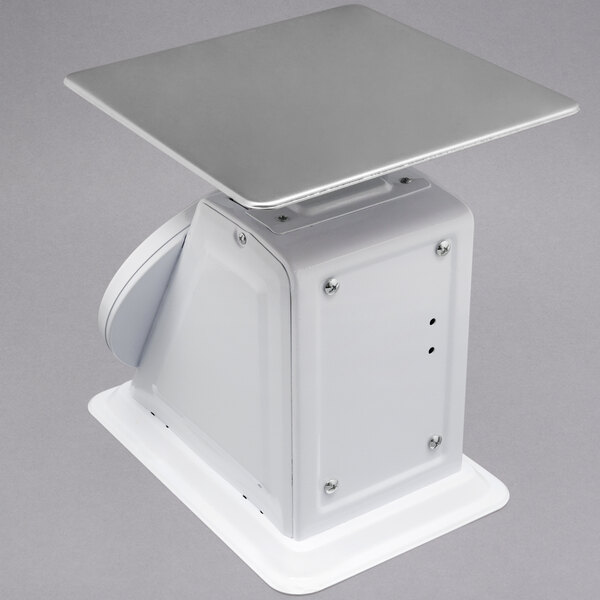 A white rectangular Cardinal Detecto scale with a silver square top.