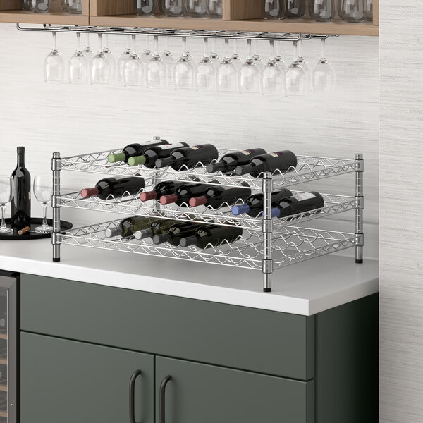 A Regency chrome wire wine shelf with wine bottles on it.