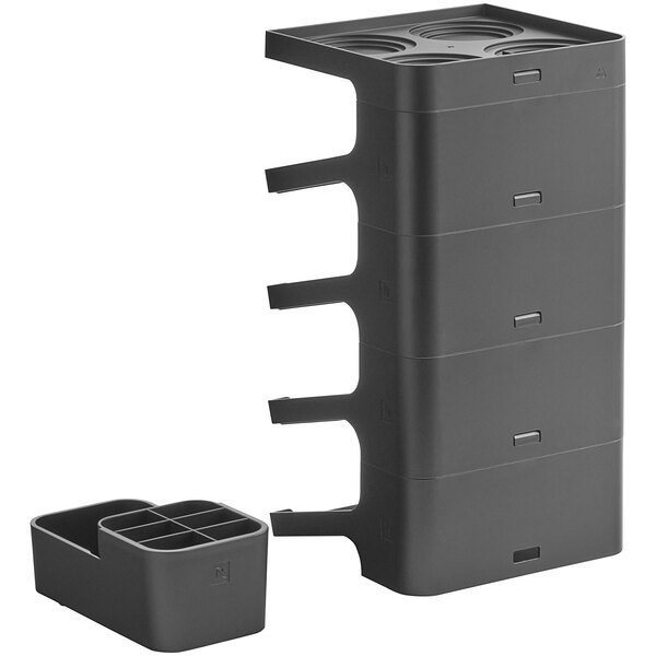 A black plastic container with three compartments for Nespresso Pro capsules.