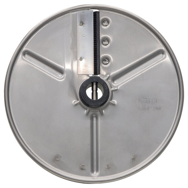 A circular stainless steel metal disc with a hole in the center.