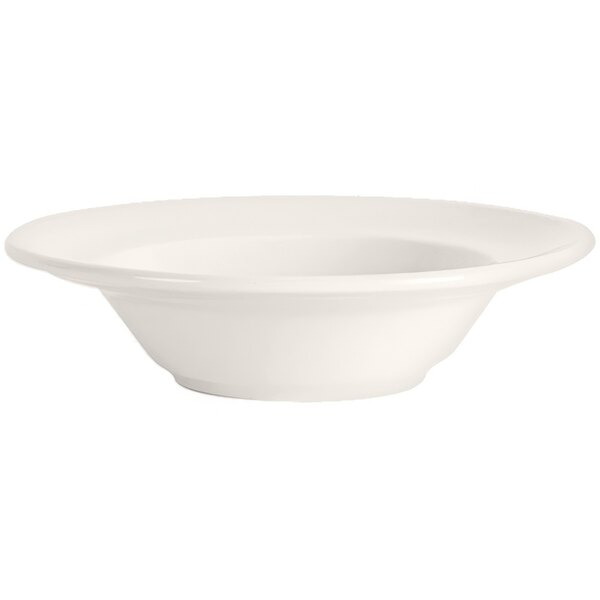 A Tuxton Columbia Eggshell white bowl with a rim.