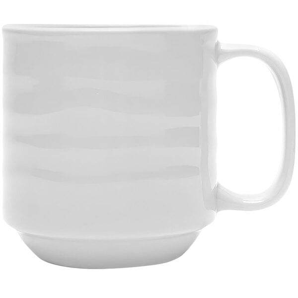 A Tuxton bright white China mug with a handle.