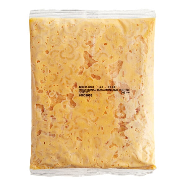 A plastic pouch of Kettle Collection macaroni and cheese sauce mix.