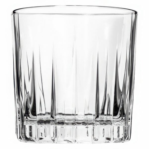 A clear Traze Rocks glass with a curved edge.
