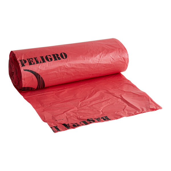 A roll of red plastic 44 gallon high density infectious waste bags.