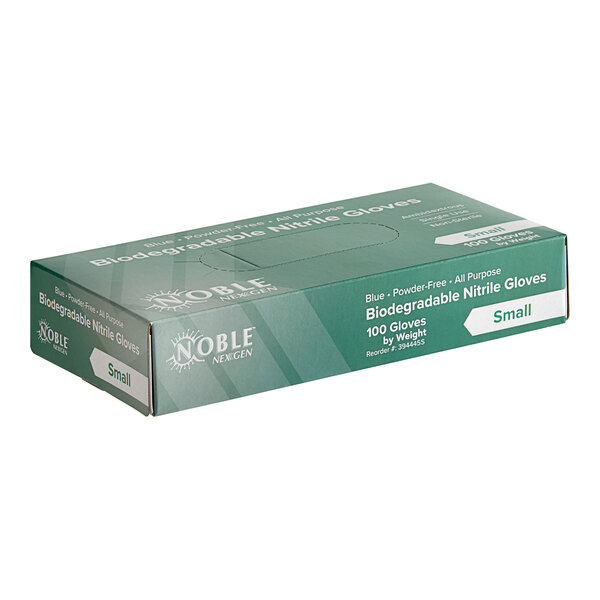 A box of Noble blue biodegradable nitrile gloves on a counter.