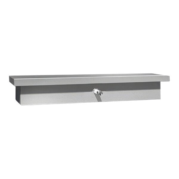 A stainless steel shelf with a soap dispenser and metal valve.