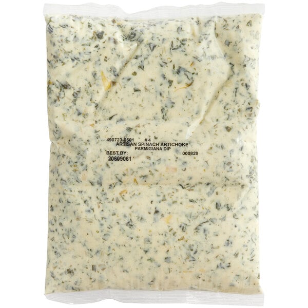 A white pouch of Kettle Collection Parmesan Spinach Artichoke Dip with green and white writing.