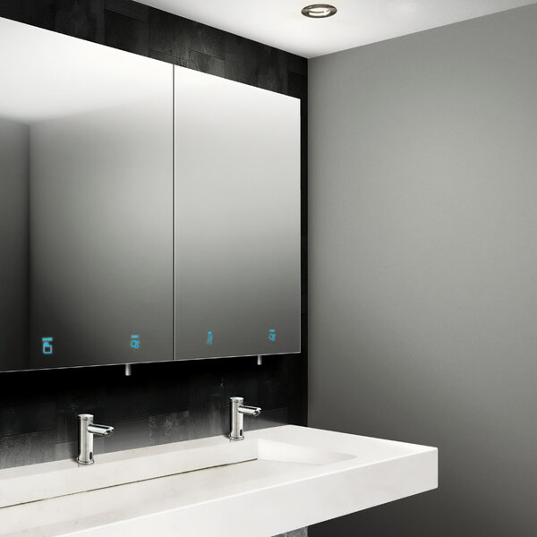 A white bathroom with a Velare stainless steel cabinet above two white sinks with silver faucets.