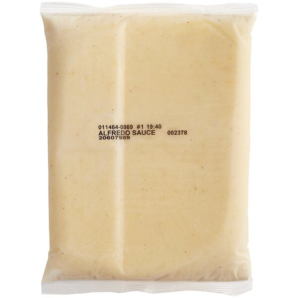 A white plastic pouch of Kettle Collection Alfredo Sauce with a label.