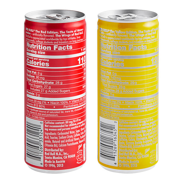 A red and yellow Red Bull Watermelon and Tropical energy drink can next to a Red Bull Tropical energy drink can.