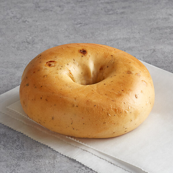 An Original Bagel with a hole in the middle on a napkin.