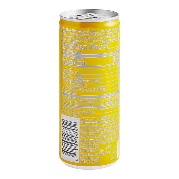 A yellow Red Bull Tropical Energy Drink can with white and black text.