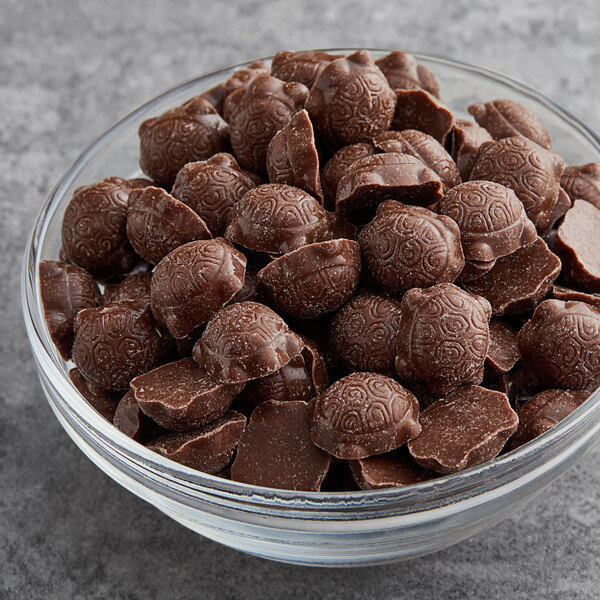 A bowl of Gertrude Hawk milk chocolate caramel turtles.