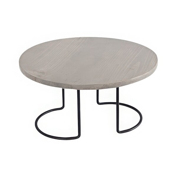 A Cal-Mil round black and grey pine display riser on a round wooden table.