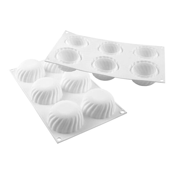 A white silicone baking mold with six rectangular cavities.