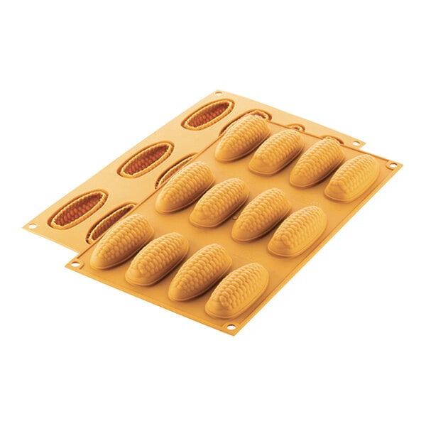 A Silikomart silicone mold with 12 corn-shaped cavities.