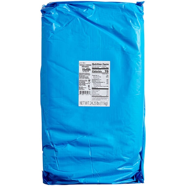 A blue package with a white label that reads "Violife Just Like Original Cream Cheese Vegan Spread"