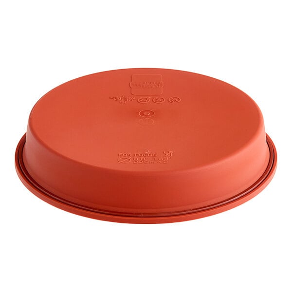 A round, red silicone baking mold.