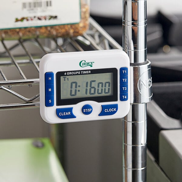 A white Choice Digital 4-channel kitchen timer with clock on a metal rack.