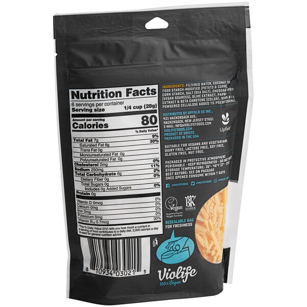 A black bag of Violife Just Like Cheddar Vegan Cheese Shreds with a white label.