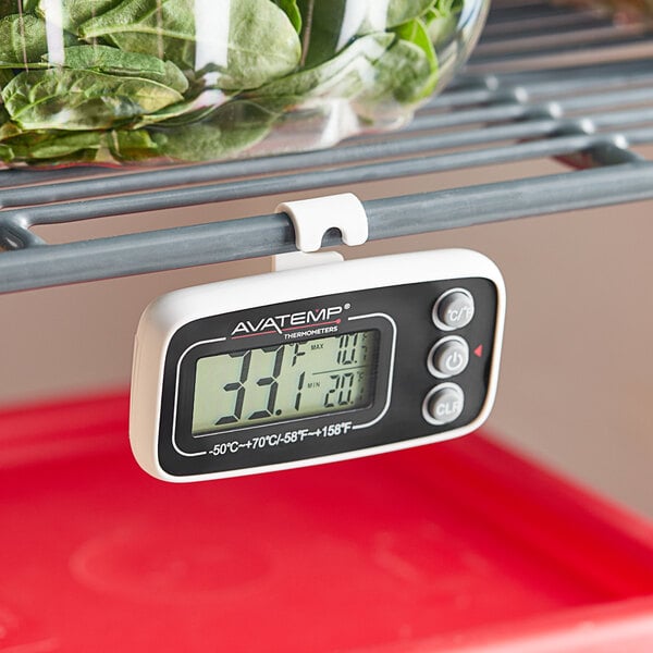 An AvaTemp digital refrigerator / freezer thermometer on a shelf.