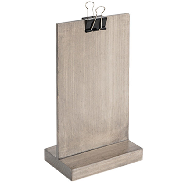 A wooden Cal-Mil clipboard menu holder with two clips on it.